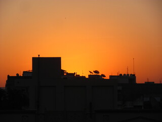 Fototapeta na wymiar Silhouette image shot against sunset
