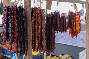 Traditional Georgian homemade sweets with hazelnuts, walnuts, grape juice and honey or sugar. (churchkhela)