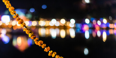 Festival lights at night with flower garland