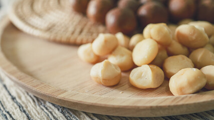 Organic Macadamia nut. macadamia nuts are cracked and baked to taste extremely delicious superfood fresh natural shelled unsalted raw macadamia and healthy food concept