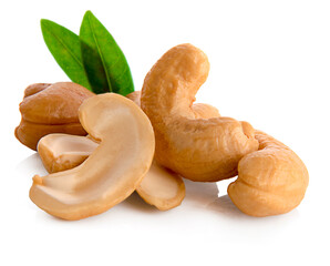 Roasted cashew nuts with green leaves isolated on white background.