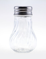 Bottle pepper. Empty glass jar on a white background.