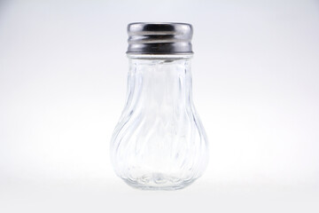 Bottle pepper. Empty glass jar on a white background.