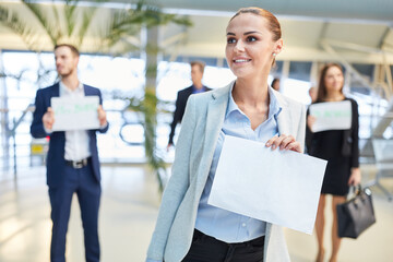 Businesswoman with blank welcome signboard as a service