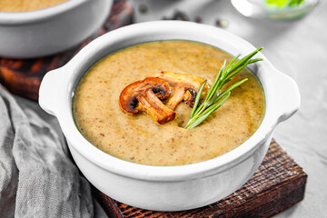  A plate of mushroom cream soup on the table close-up, soup with champignons