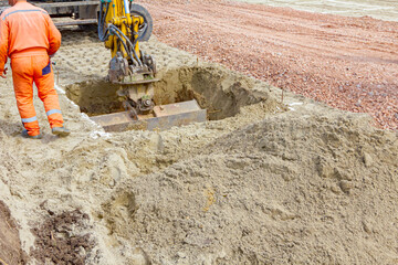 Group of workers with safety gear at construction site