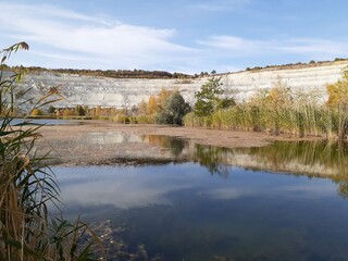 
lake in the forest in the Volskiy Cretaceous quarry, Saratov region, Russia