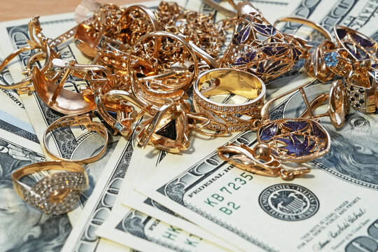 jewelry scrap of gold and silver and money, pawnshop concept