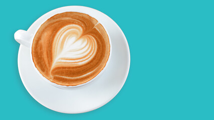 Cup of coffee latte with heart pattern isolated on blue background. Top view. Banner.