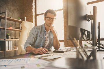 Portrait of his he nice attractive focused busy guy coding programming designing web planning team...