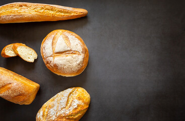 Assorted loaves, baguettes and slices of homemade artisan bread
