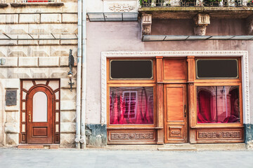 Fototapeta na wymiar Old houses and closed window shop at market square in Lviv, Ukraine