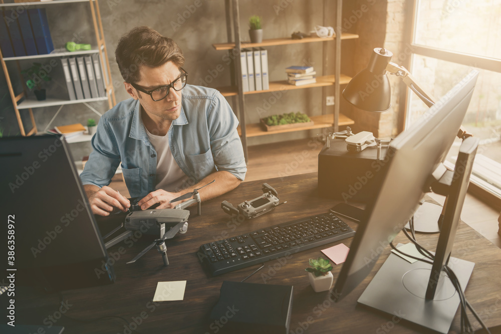 Wall mural portrait of his he nice attractive confident focused geek guy tech manager inventing repairing copte