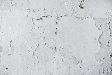 Grunge white texture of weathered wall with paint peeling off