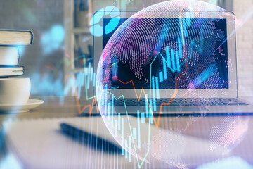 Multi exposure of graph and financial info and work space with computer background. Concept of...