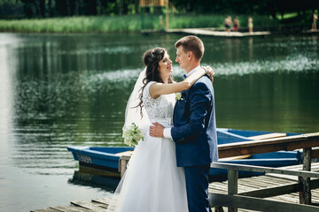 bride and groom on the pier