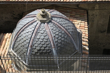 round roof covered with slate roof tiles on a chapel
