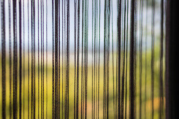 thread curtains in the bedroom window
