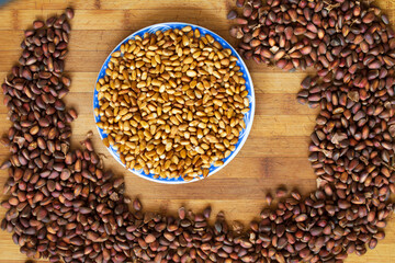 cedar nut on wooden background