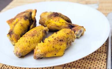 fried chicken wings on white plate