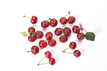 Naklejka na ściany i meble Image cherries on a white background. Cherries with drops isolated on white background