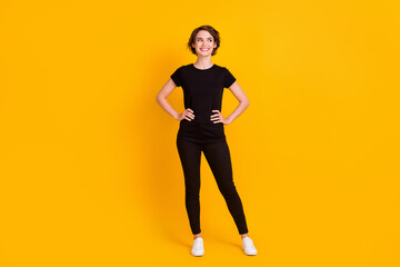 Fototapeta na wymiar Full length body size view of skinny creative curious cheerful girl looking aside copy space think isolated bright yellow color background