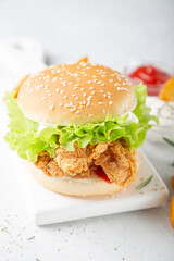 Chicken burger on a light background