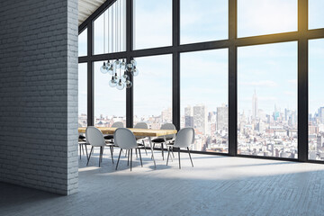 Bright modern kitchen interior with furniture and city view.