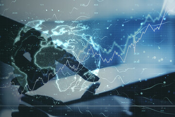 Hand using digital laptop with digital earth