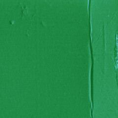 A green vintage rough sheet of carton. Recycled environmentally friendly cardboard paper texture. Simple and bright minimalist papercraft background.