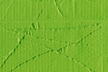 A green vintage rough sheet of carton. Recycled environmentally friendly cardboard paper texture. Simple and bright minimalist papercraft background.