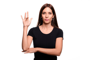 Isolated in white background brunette woman saying friday in spanish sign language