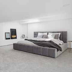 White and gray bedroom with big bed