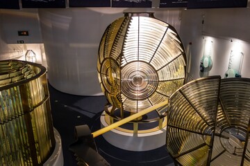 Double flash 1st order lighthouse lens resembling C-3PO robot and other nautical equipment at...