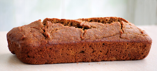 Homemade whole grain einkorn bread on a white surface. Close up picture