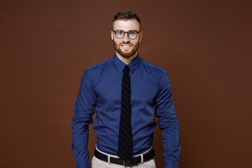 Smiling successful handsome bearded young business man in blue shirt tie eyeglasses looking camera...