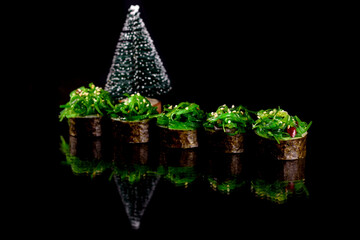 Fresh delicious beautiful sushi rolls on a dark background