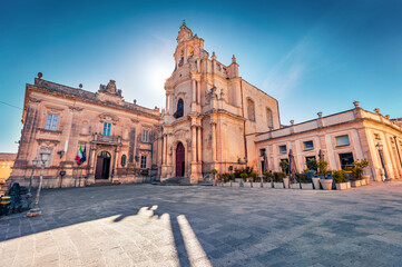 Empty Piazza Duomo square with  Duomo San Giorgio - baroque Catholic church. Spectacular morning cityscape of Ragusa, Sicily, Italy, Europe. Traveling concept background. Wide angle picture.
