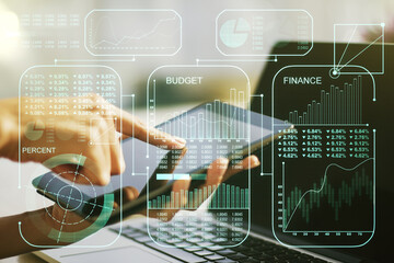 Multi exposure of abstract graphic data spreadsheet sketch and hand working with a digital tablet on background, analytics and analysis concept