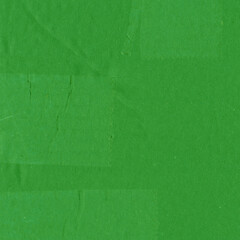 Obraz premium A green vintage rough sheet of carton. Recycled environmentally friendly cardboard paper texture. Simple and bright minimalist papercraft background.