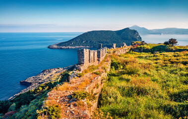 Sunny spring view of popular tourist destination - Navarino Castle. Bright morning seascape of...
