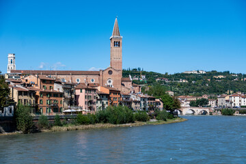 View of the Adige River with the Anastasia Basilica in the background in Verona, Italy