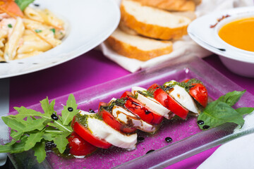 Classic Italian caprese salad with tomatoes and mozzarella.