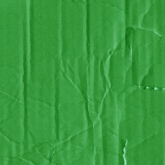A green vintage rough sheet of carton. Recycled environmentally friendly cardboard paper texture. Simple and bright minimalist papercraft background.