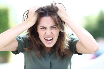 Angry woman shouting looking at camera