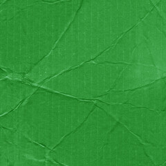 A green vintage rough sheet of carton. Recycled environmentally friendly cardboard paper texture. Simple and bright minimalist papercraft background.
