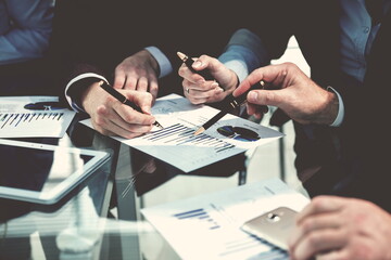 close up. business colleagues checking financial charts.