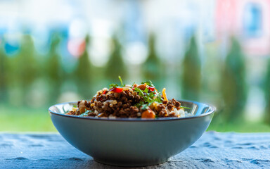 Rice with minced meat and vegetables, cooked in Chinese and Thai style.