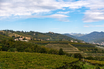 Fototapeta na wymiar Beautiful view over the hills of the Veneto Region in Italy. It is one of the famous Italian Winemaking Region with small picturesque towns