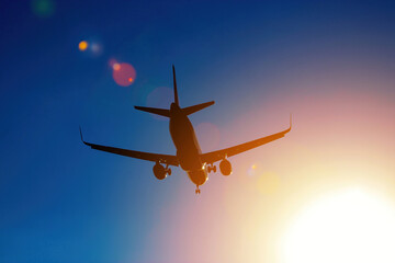 Fototapeta premium lying airplane silhouette in the blue sky
